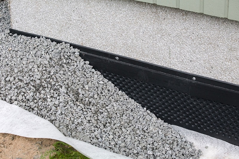 #57 Stone base used as drain near foundation of house in Orlando